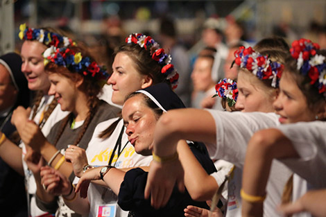 World Youth Day pilgrims sing and dance following a July 30 prayer vigil at the Field of Mercy in Krakow, Poland. (CNS photo/Bob Roller)