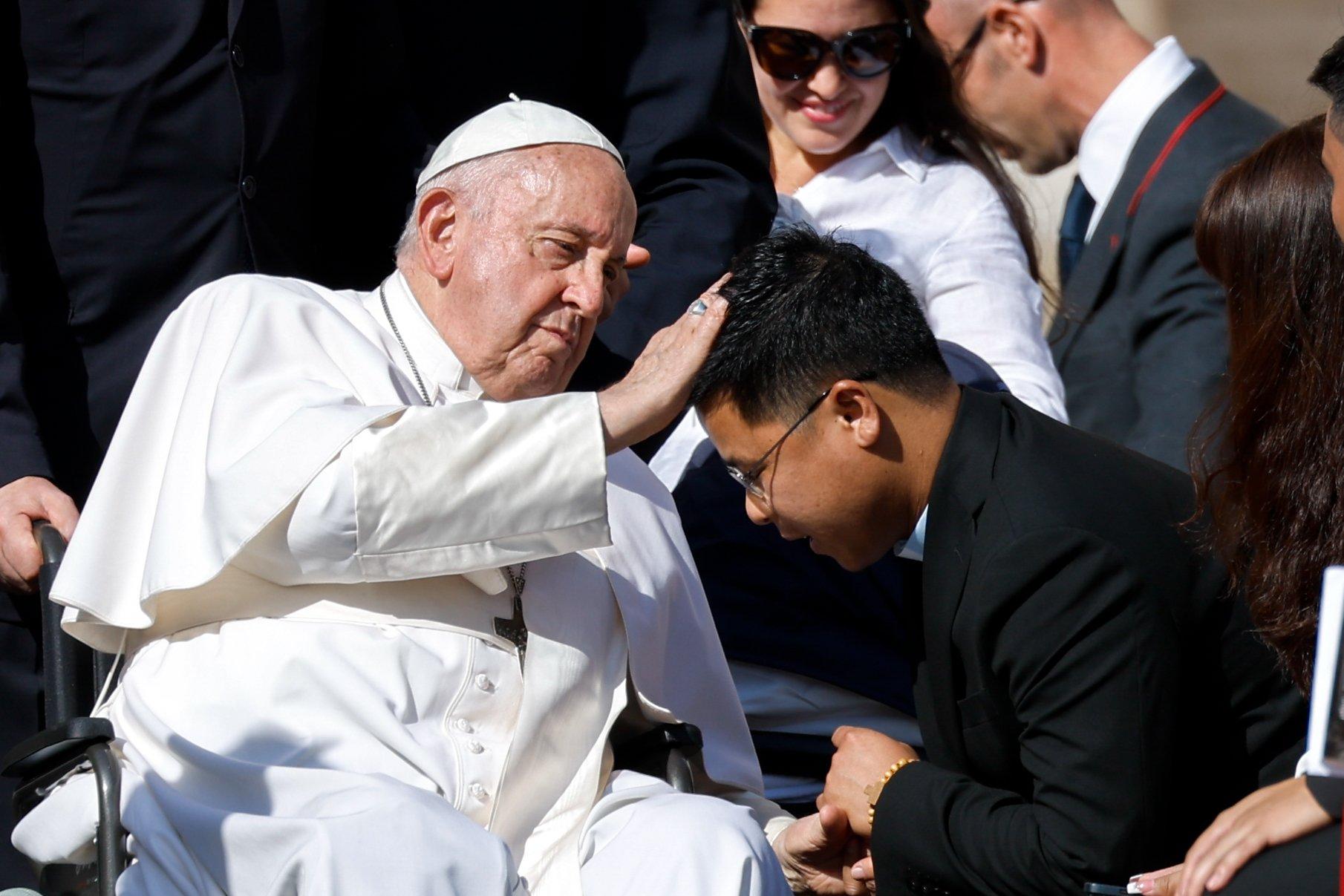 Pope Francis blesses young man