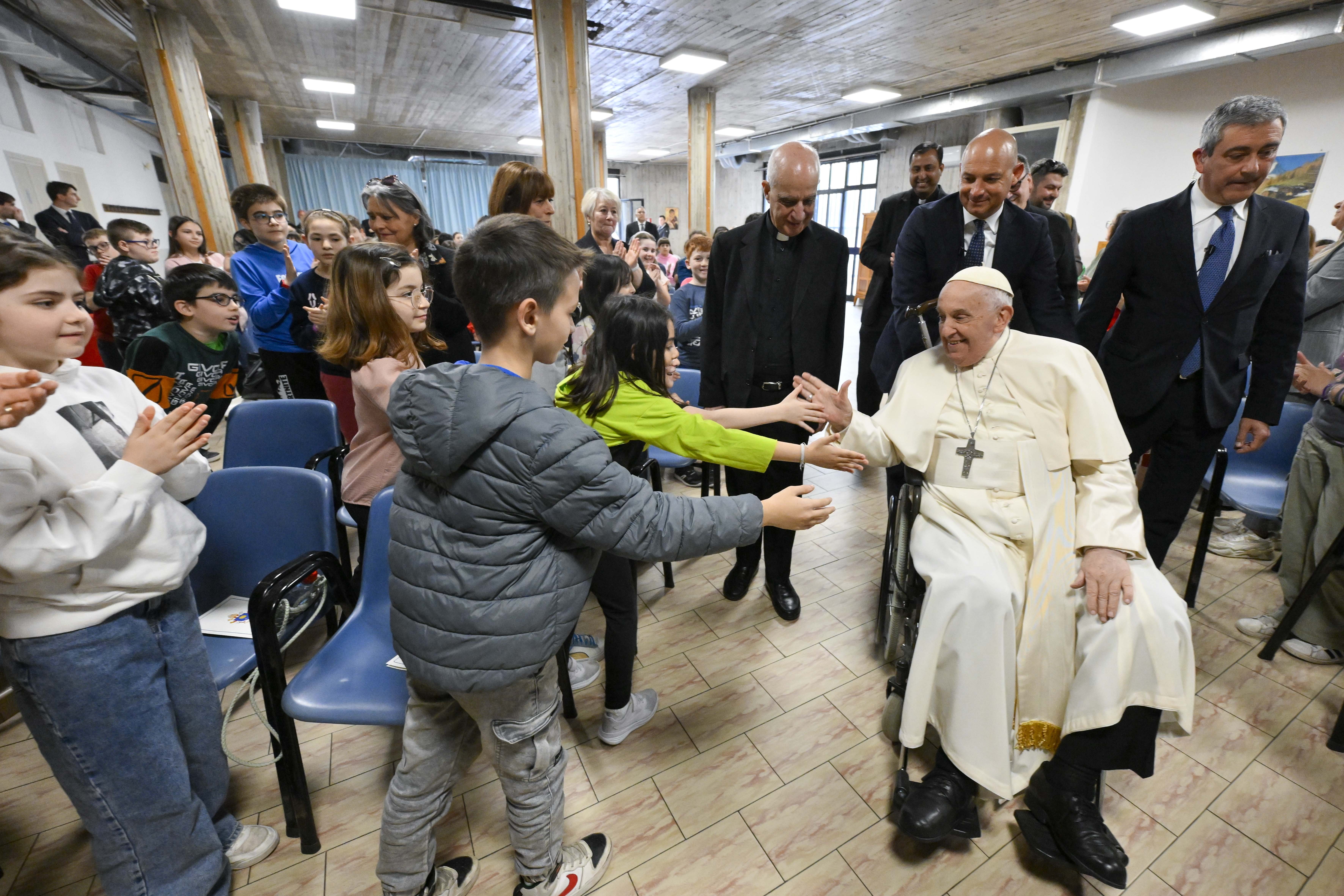 Pope Francis greets children at Rome parish