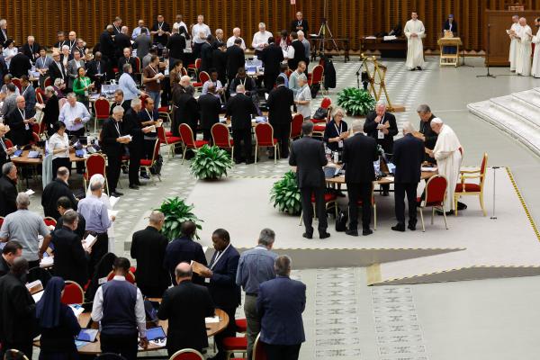 Pope Francis joins members of the assembly of the Synod of Bishops for prayer.