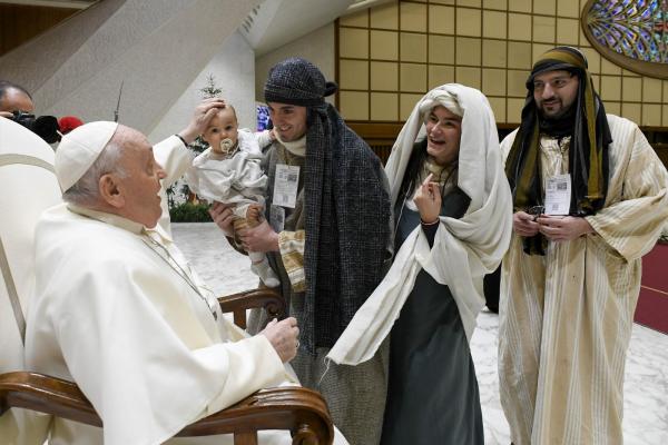 Pope Francis and characters from living Nativity scene