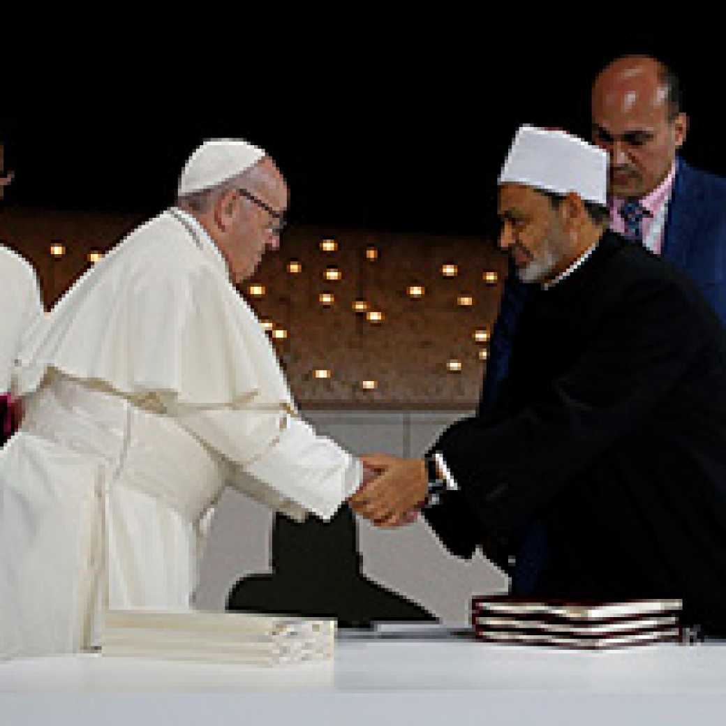Pope Francis and Tayyeb greeting each other